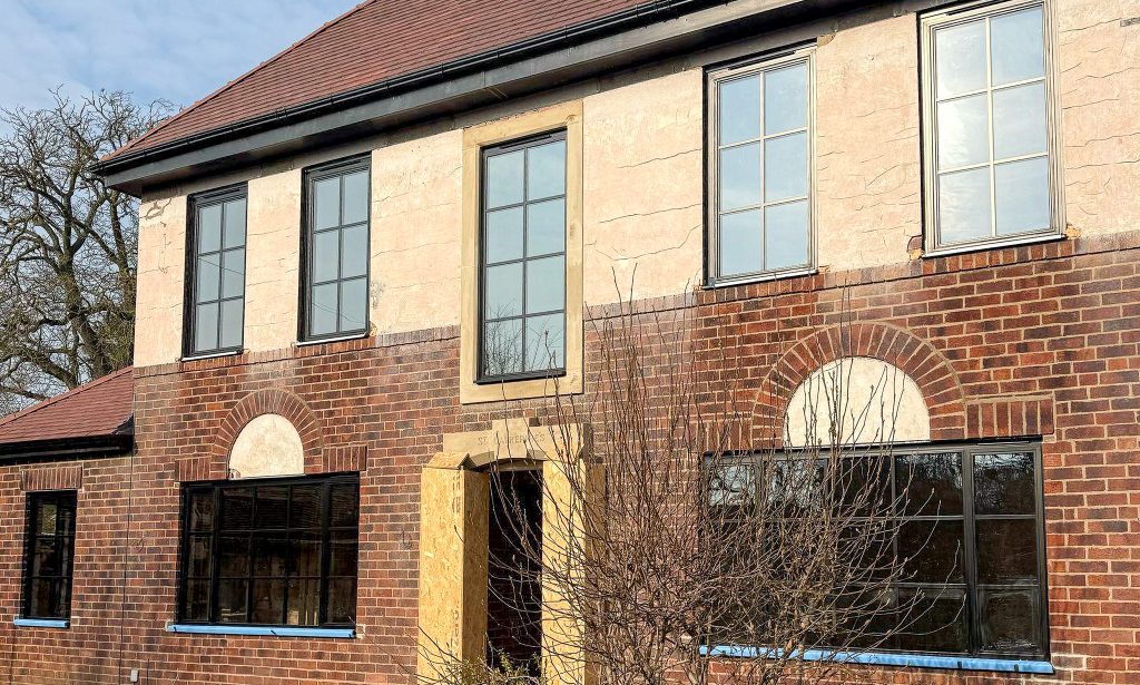 steel look windows in black to a doncaster detached house with render and brick