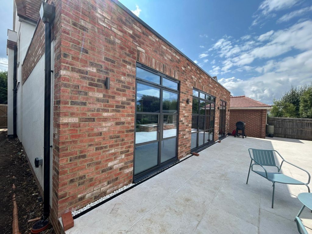 steel look doors in a brick extension
