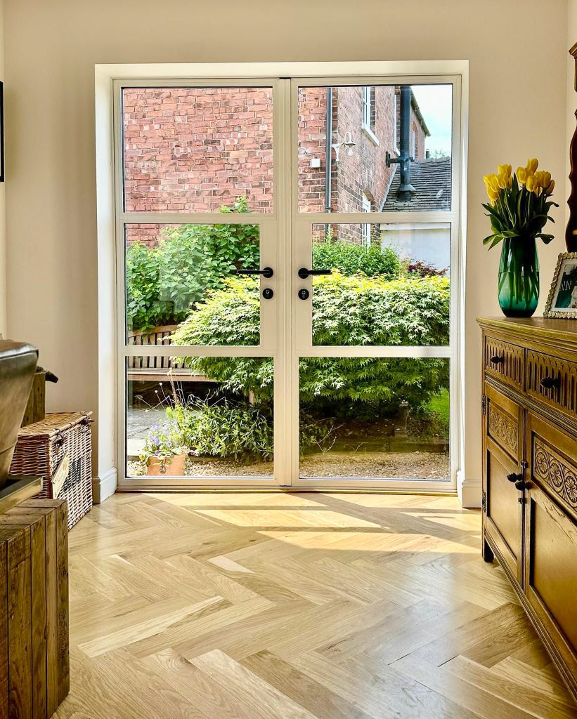 inside view of white heritage door in a dining room setting with wood floor