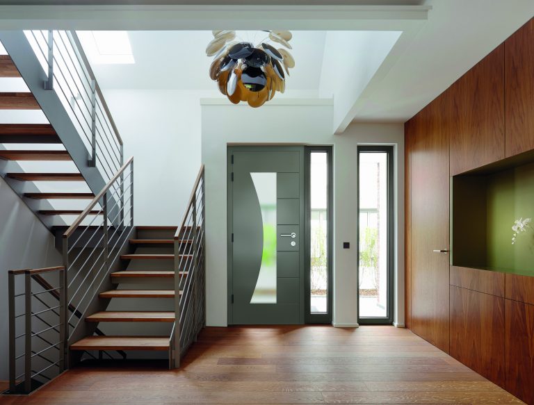 T3TBT0 Plank floor and walnut wall covering in home near staircase