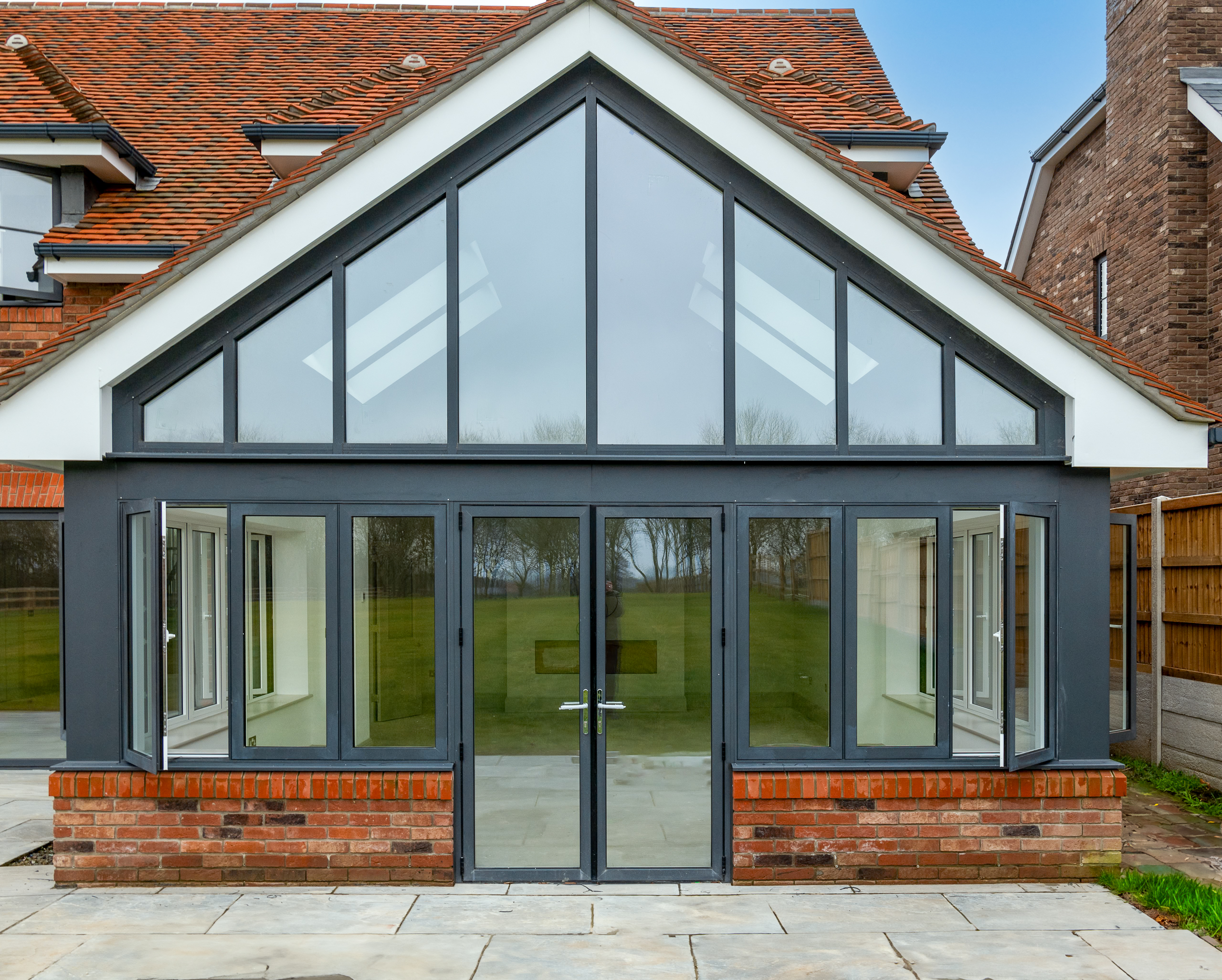 picture of glazed extension with patio doors gable, rooflights and windows