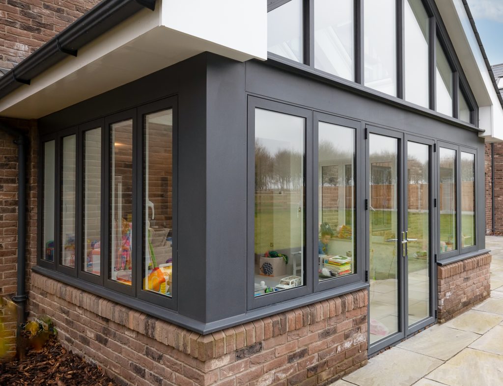 picture of glazed extension with patio doors gable, rooflights and windows